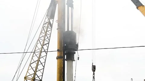 Pile driver hammers concrete pile Stock Footage 181587359