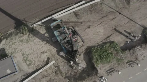 Pile driving machine driving piles into ground site. Stock Footage 231998801