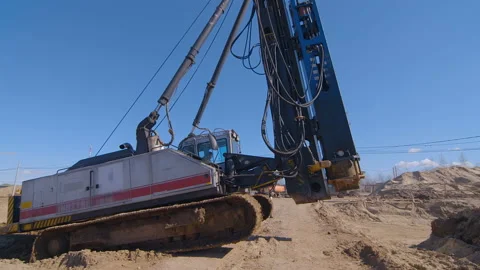 Pile driving machine moves to the next piles driving location Stock Footage 161955875