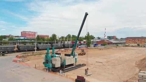 Pile driving machine working on construction site Stock Footage 347833818