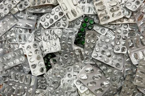 A pile of empty pill blisters, a concept in pharmacology and medicine 库存照片