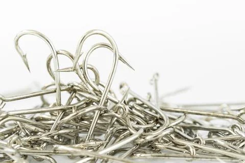 Pile of fish hook on a white Stock Photos