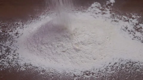 A pile of flour on a dark table Stock Footage 141622432