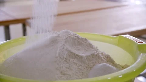 Pile of flour in a light green plastic bowl in the bakery Stock Footage 204855641