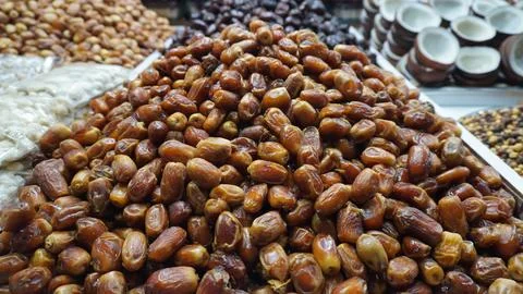A Pile of Fresh Brown Dates Displayed at Traditional Market Shop Stock Photos