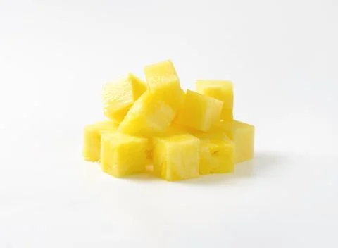 Pile of fresh pineapple cubes Stock Photos