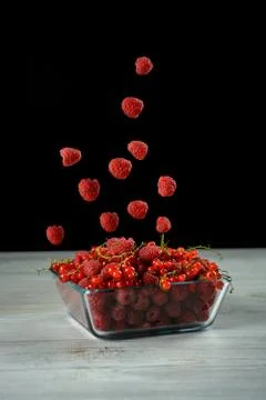 Pile of fresh raspberry and red currant Stock Photos