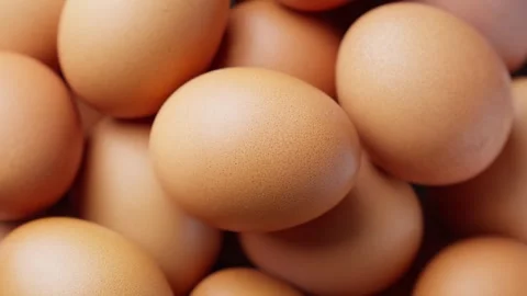 Pile of fresh raw eggs rotating. Healthy fresh ingredients for breakfast. Top Stock Footage 304550910