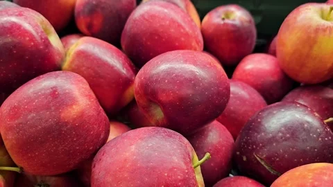 Pile of fresh red apples with stems. Closeup fruit footage Stock Footage 297610746