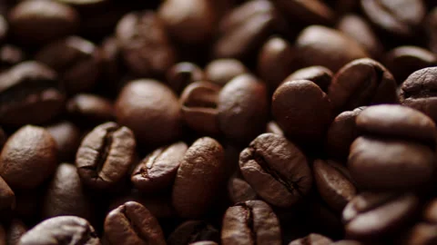 A pile of fresh roasted coffee beans. Cinematic macro video of aromatic ara.. Stock Footage 337127425