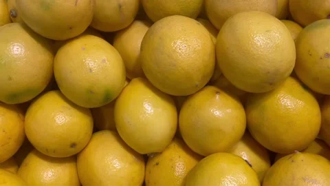 Pile of fresh yellow lemons at fruit market 스톡 동영상 340485732