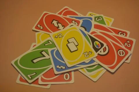 Pile of game cards on pink background that can be used as wallpaper 11 Stock Photos