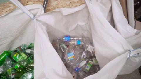 A pile of garbage, plastic bottles collected in plastic garbage bags. Sorting Stock-Footage 168079655
