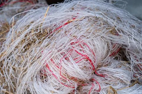 Pile of garbage, plastic threads of packing material of straw in a large pile Stock Photos