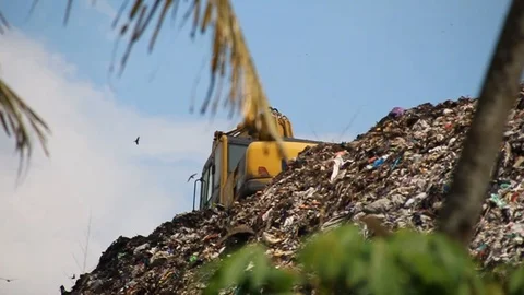 A pile of garbage from the surrounding community becomes a mountain of garbage Stock Footage 124305198