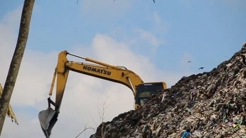 A pile of garbage from the surrounding community becomes a mountain of garbage Stock Footage 124305204