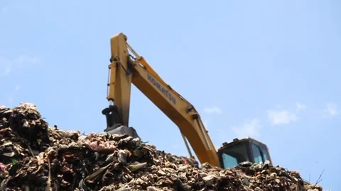 A pile of garbage from the surrounding community becomes a mountain of garbage Stock Footage 124305332
