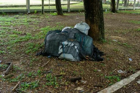 Pile of garbage in white bag. Stock Photos
