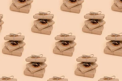 Pile of gift boxes pattern on a beige background. Stock Photos