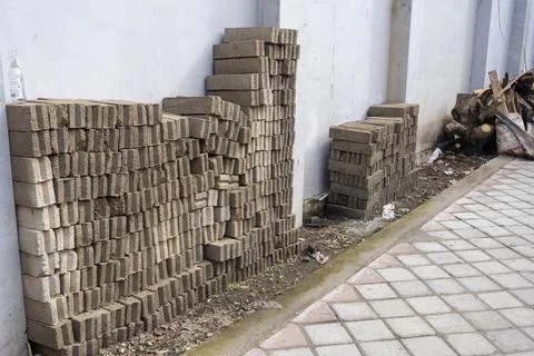 Pile of gray bricks stacked on top of each other Stock Photos