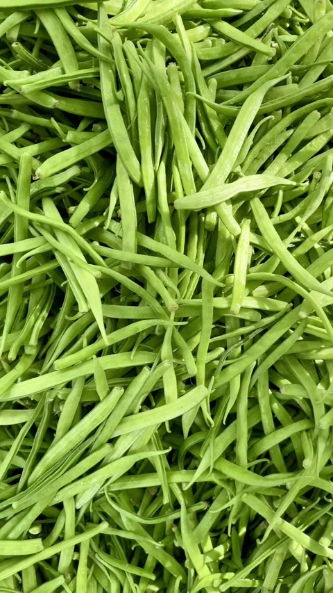 A pile of green Cluster beans or gavar fali for selling on a street shop Stock Footage 287437826