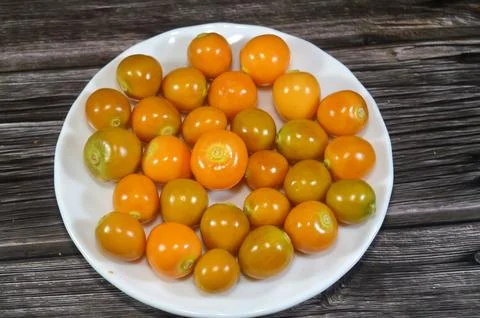 Pile of ground cherry fruit, small, orange berry from the Physalis genus, w.. Stock Photos