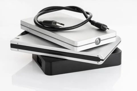 Pile of a group of external Hard disk drive on white table. HDD Data storage 스톡 사진