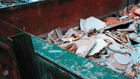 Pile of Hazardous Construction Materials Waste In Large Metal Garbage Container Video stock 156418978