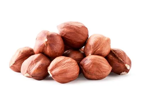 A pile of hazelnuts closeup on white background. Isolated Stock Photos