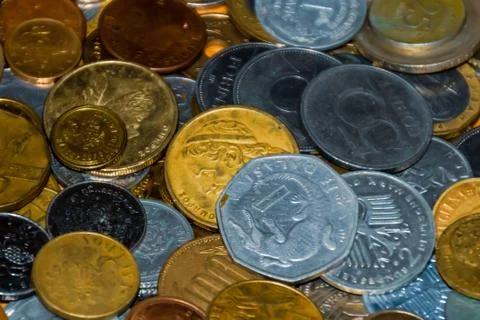 A pile / heap of assorted coins, both old which are no longer in circulation  Stock Photos