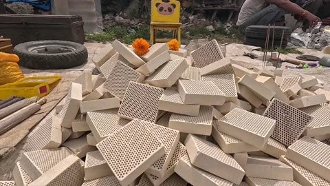 Pile of Honeycomb Ceramic Filter Bricks Sold at Outdoor Street Flea Market Stock Footage 346656207