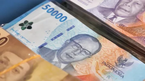 Pile Indonesian Rupiah banknotes in the 5.000, 10.000 and 50.000 Stock Footage 239723108
