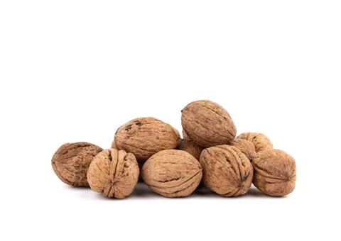 Pile of inshell walnuts isolated on a white background 스톡 사진