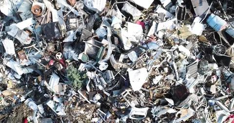 A pile of junk including a broken television and a broken refrigerator Stock Footage 291909680