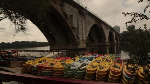 A pile of kayaks on the river edge Stock Footage 145737591