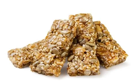 Pile of kozinaki close-up on a white background. Isolated Stock Photos