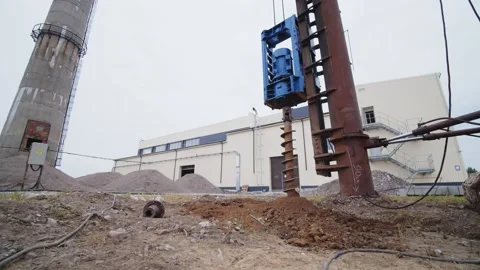 Pile Machine Drilling Foundations of the Future Building Stock Footage 197115661