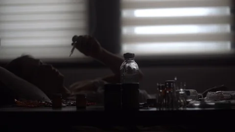 Pile of medicine on the table in the foreground Stock Footage 125809855