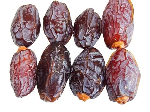 Pile of Medjool dates isolated on white Fotos de archivo