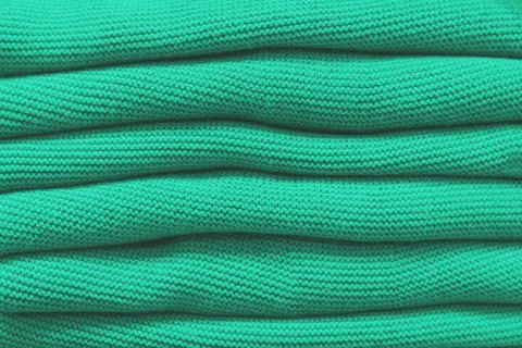 Pile of mint sweaters Stock Photos
