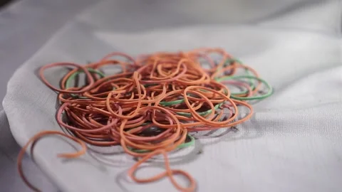 A pile of multi-color rubber bands Stock Footage 201510147