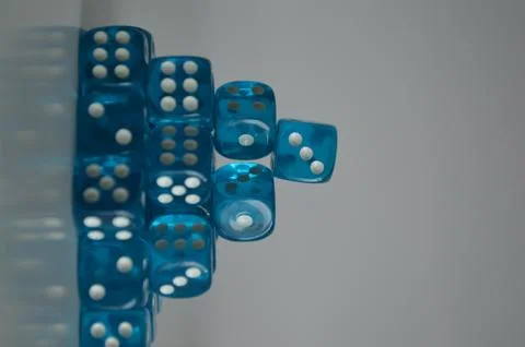 Pile of multiple blue plastic arcylic d6 six sided die dice variable focus Foto stock