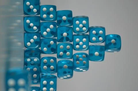 Pile of multiple blue plastic arcylic d6 six sided die dice variable focus Stock-Fotos