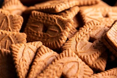 A pile of multiple brown cookies called speculoos or speculaas in Belgium o.. Stock Photos