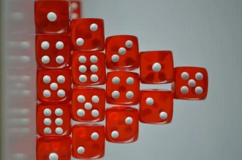 Pile of multiple red plastic arcylic d6 six sided die dice variable focus Foto stock