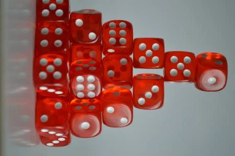 Pile of multiple red plastic arcylic d6 six sided die dice variable focus Stockfoto's