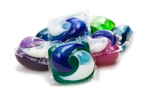 Pile of multiple washing pod capsules isolated Stock Photos