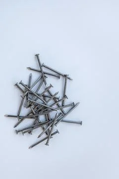 Pile of nails on a solid packground Stock Photos