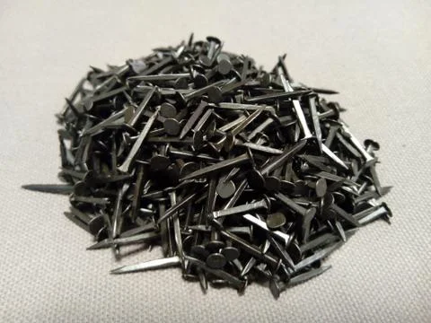 Pile of nails on white background Stock Photos