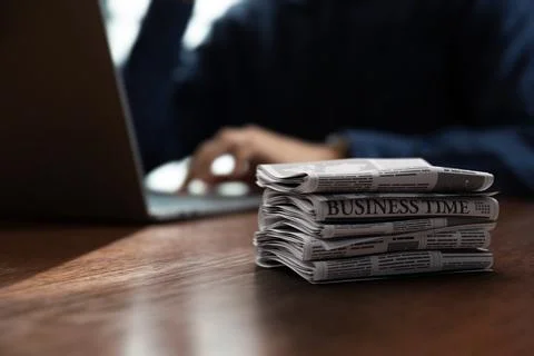 Pile of newspaper puts on the table in front of businessman Stock Photos